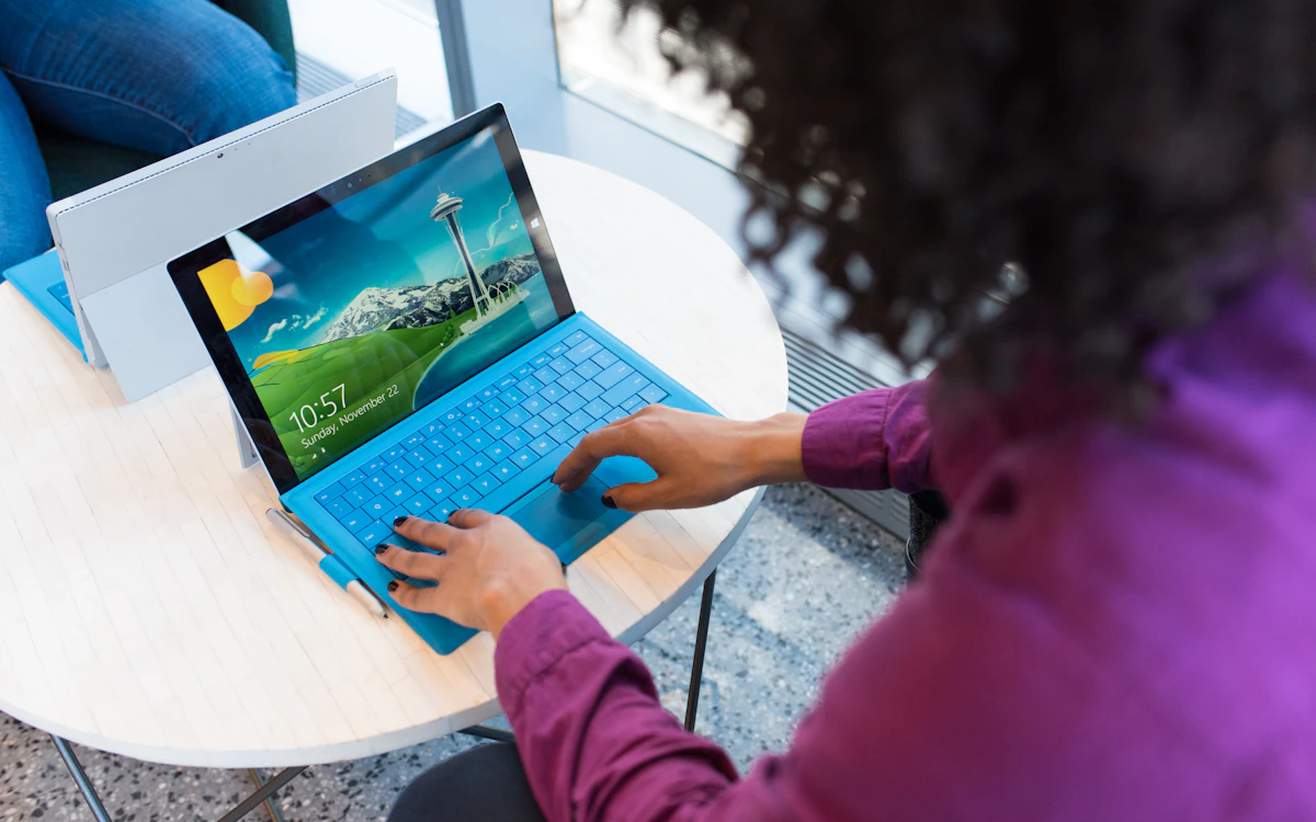 Fundraiser working on a laptop with data visualisations, illustrating AI in fundraising