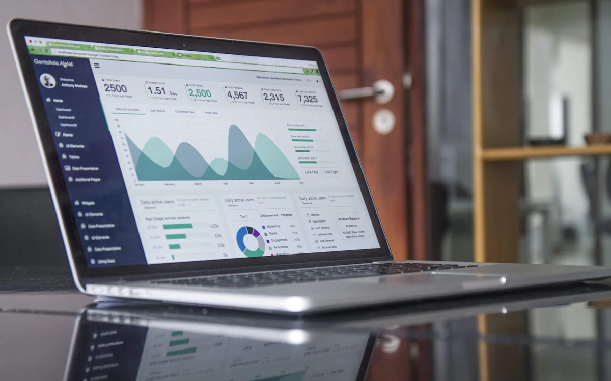 Analytics dashboard on a laptop showing fundraising revenue and donor trends