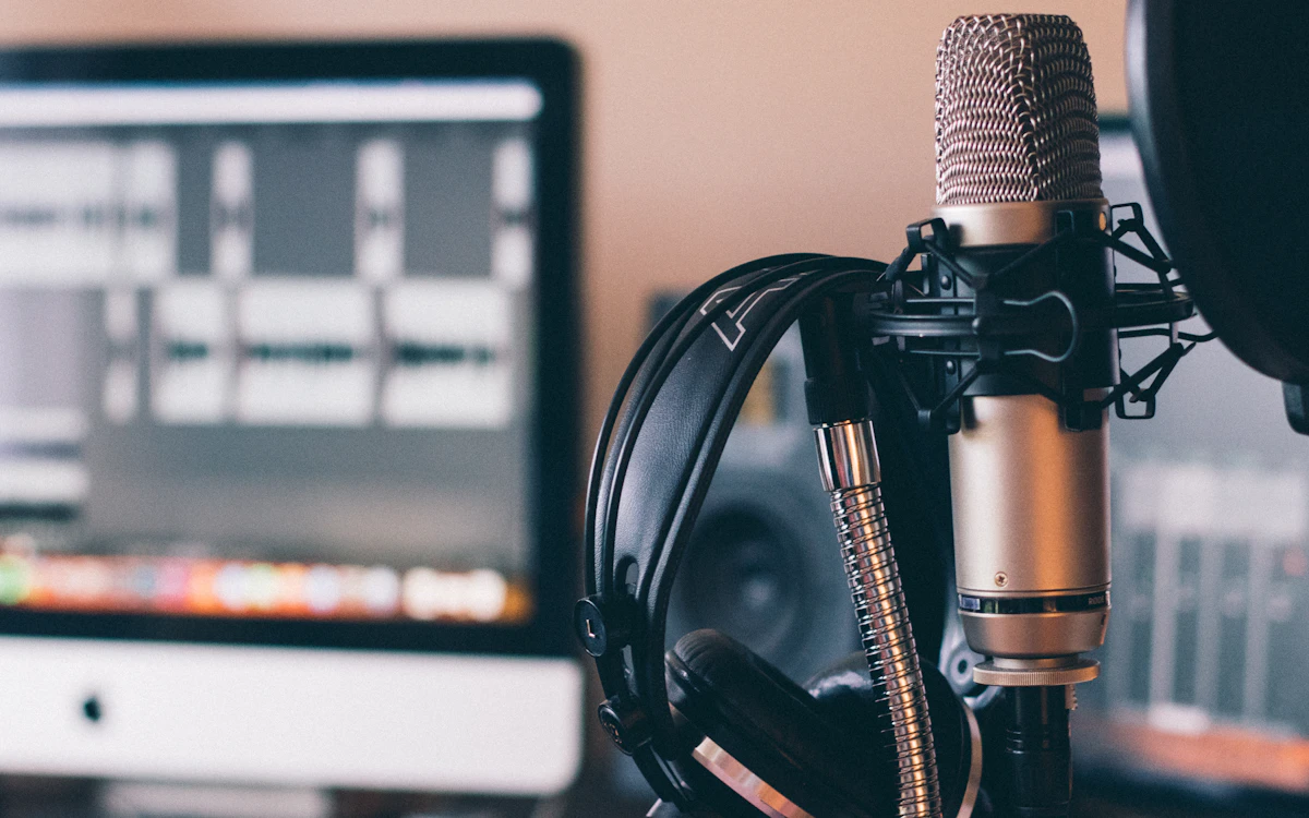 Podcast host at a microphone during a nonprofit interview